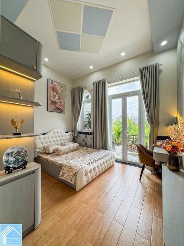 BÁN NHÀ mới xây - Mặt Tiền - KDC CỬU LONG (Có phòng ngủ tầng trệt)